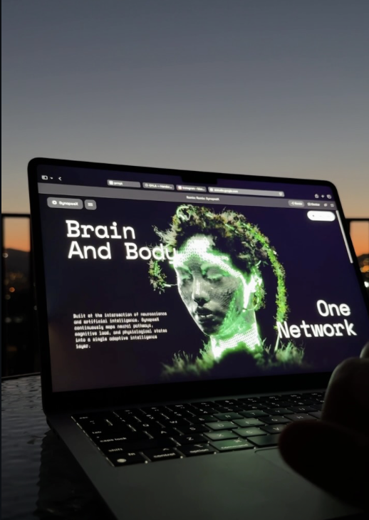 "Brain and body, one network" AI startup post on a laptop screen